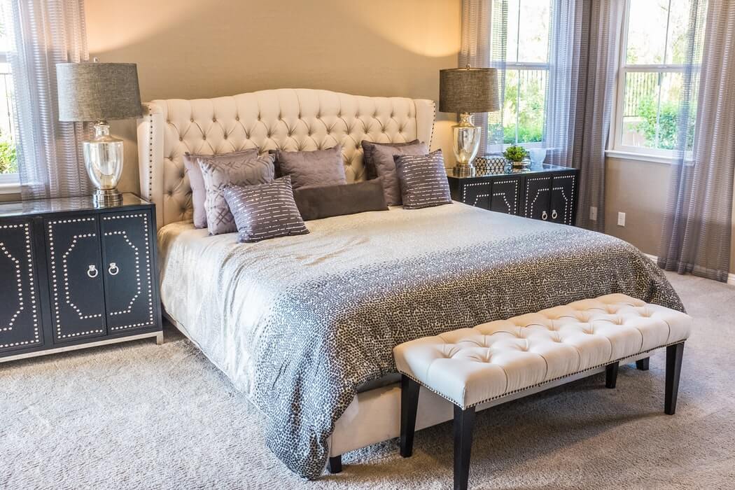 bed with bench at the foot