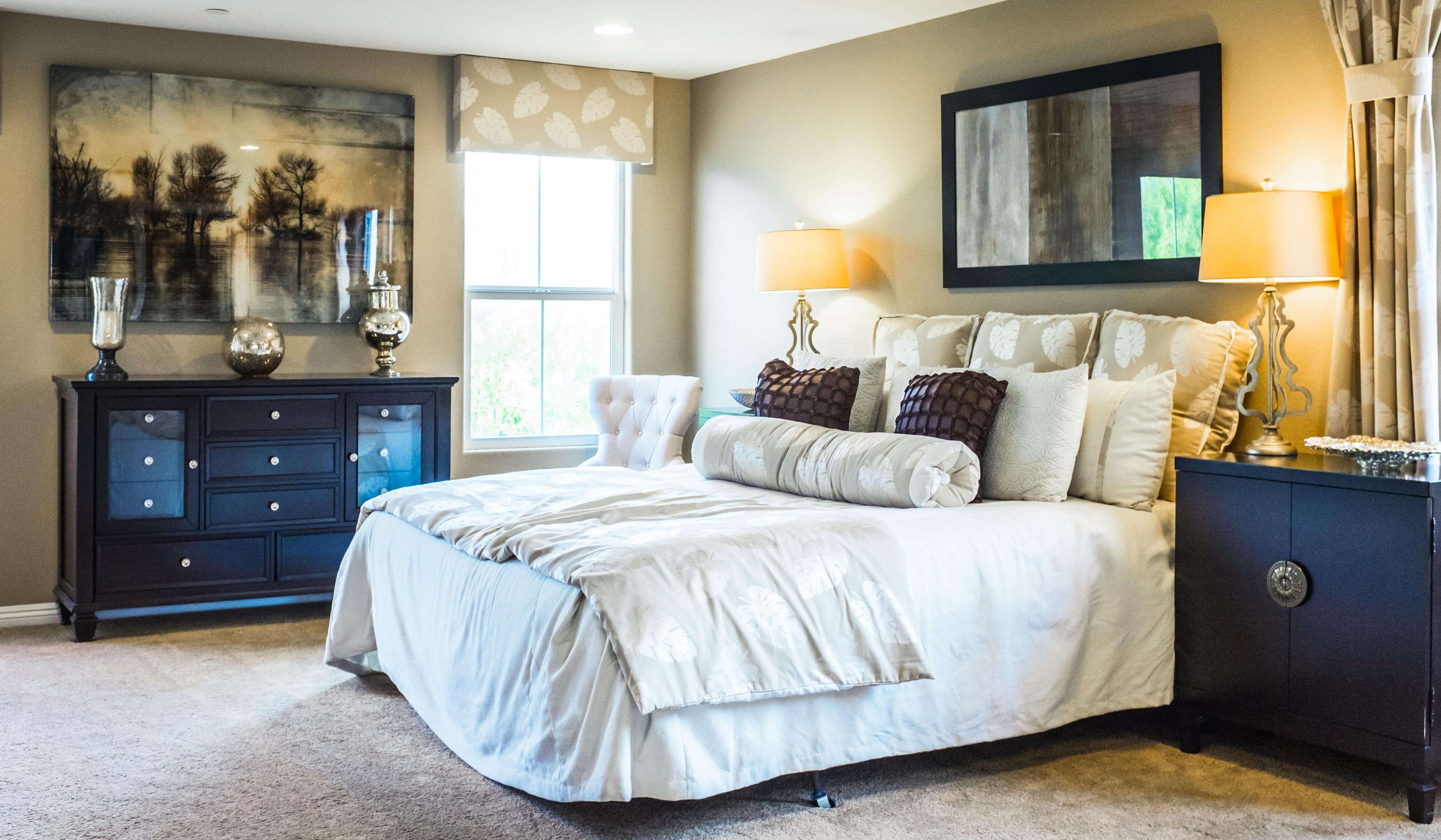 Carpeted bedroom decorated in blues and whites
