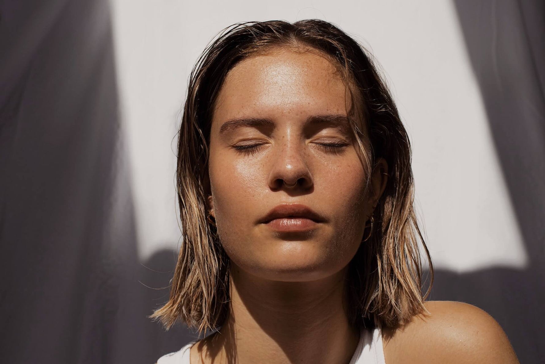 a woman with her eyes closed